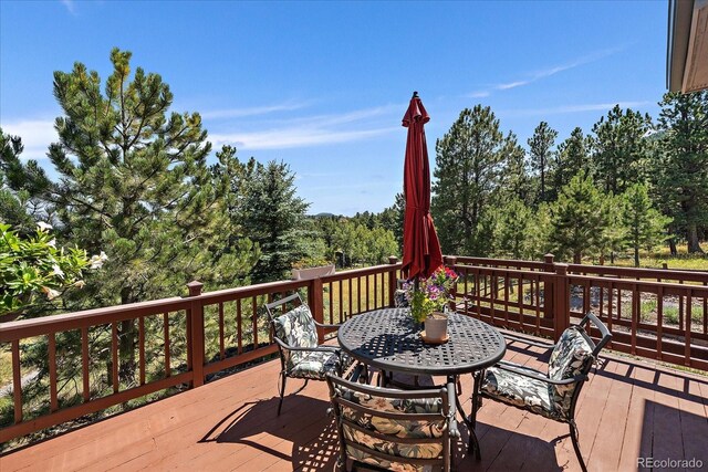 31518 Niakwa Rd, Evergreen, CO 80439 - wooden deck with outdoor dining area