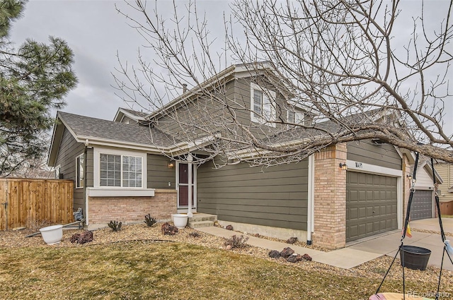 view of front of home with a garage and a front lawn