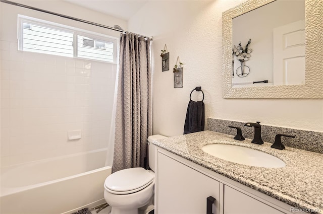 full bathroom with vanity, toilet, and shower / bath combo with shower curtain