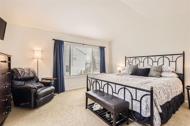 bedroom featuring light carpet and lofted ceiling