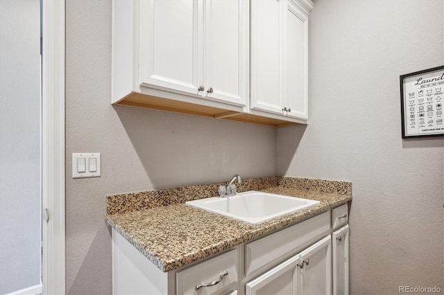 10397 Helsinki St, Parker, CO 80134 - laundry area with a sink and a textured wall