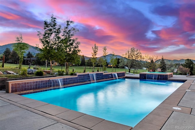5727 Colorow Dr, Morrison, CO 80465 - pool at dusk with a mountain view and a pool with connected hot tub