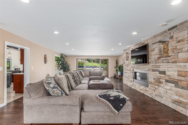 5727 Colorow Dr, Morrison, CO 80465 - living area featuring dark wood-style floors, a fireplace, and recessed lighting