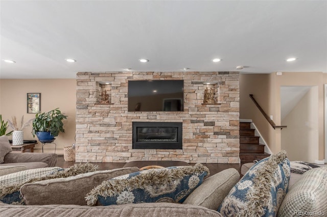 5727 Colorow Dr, Morrison, CO 80465 - living room featuring recessed lighting, stairs, and a stone fireplace