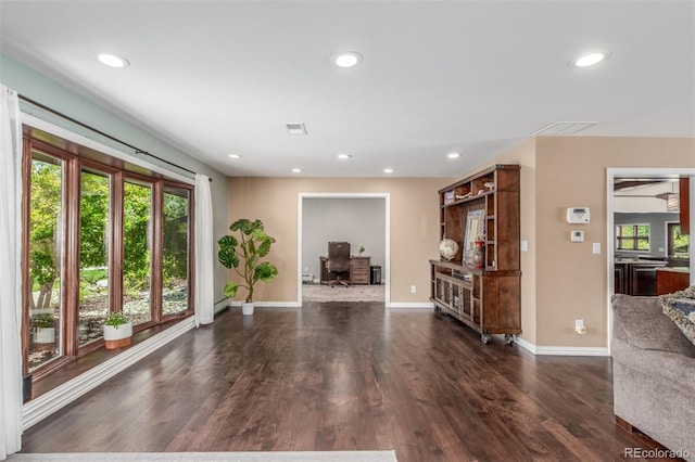 5727 Colorow Dr, Morrison, CO 80465 - living room featuring plenty of natural light, wood finished floors, baseboards, and recessed lighting