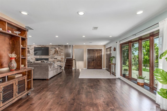 5727 Colorow Dr, Morrison, CO 80465 - foyer entrance featuring a stone fireplace, recessed lighting, and wood finished floors