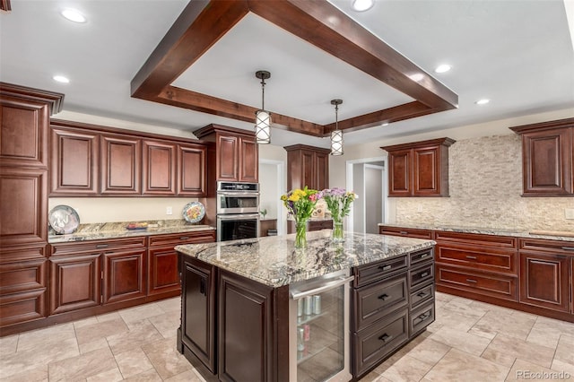 5727 Colorow Dr, Morrison, CO 80465 - kitchen featuring beverage cooler, a tray ceiling, stainless steel double oven, tasteful backsplash, and a kitchen island