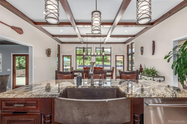 5727 Colorow Dr, Morrison, CO 80465 - kitchen with stainless steel dishwasher, coffered ceiling, beam ceiling, healthy amount of natural light, and stone countertops