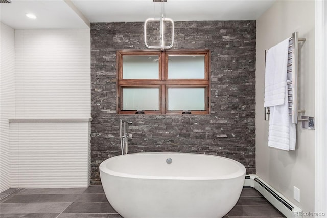 5727 Colorow Dr, Morrison, CO 80465 - full bath featuring a freestanding bath, tile patterned flooring, and a baseboard heating unit