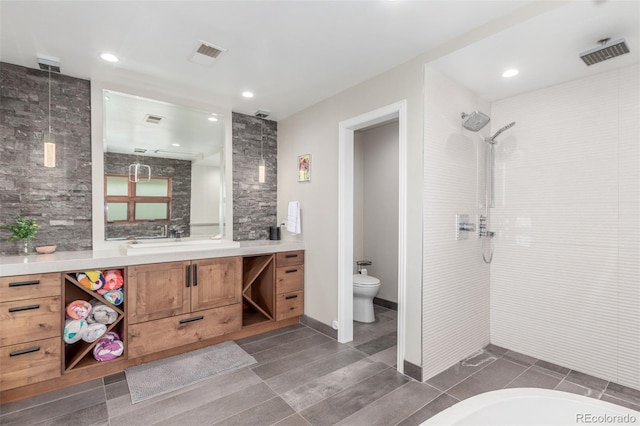 5727 Colorow Dr, Morrison, CO 80465 - full bathroom featuring tiled shower, vanity, toilet, and recessed lighting