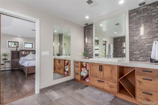 5727 Colorow Dr, Morrison, CO 80465 - ensuite bathroom with vanity, baseboards, and recessed lighting