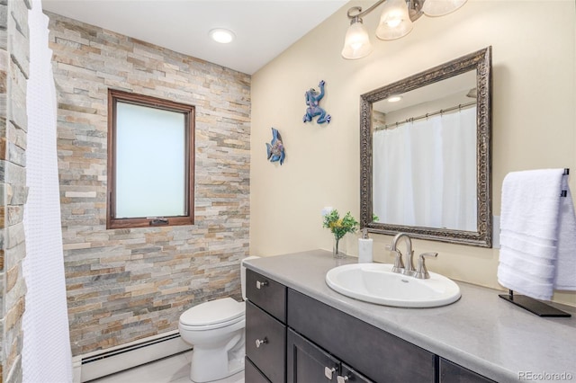 5727 Colorow Dr, Morrison, CO 80465 - full bathroom with baseboard heating, vanity, and toilet
