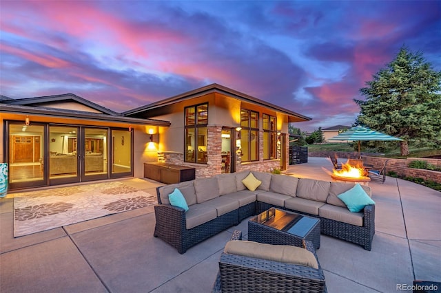 5727 Colorow Dr, Morrison, CO 80465 - view of patio with an outdoor living space with a fire pit