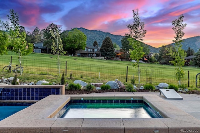 5727 Colorow Dr, Morrison, CO 80465 - pool at dusk featuring a mountain view