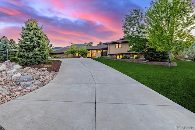 5727 Colorow Dr, Morrison, CO 80465 - tri-level home featuring a yard and concrete driveway