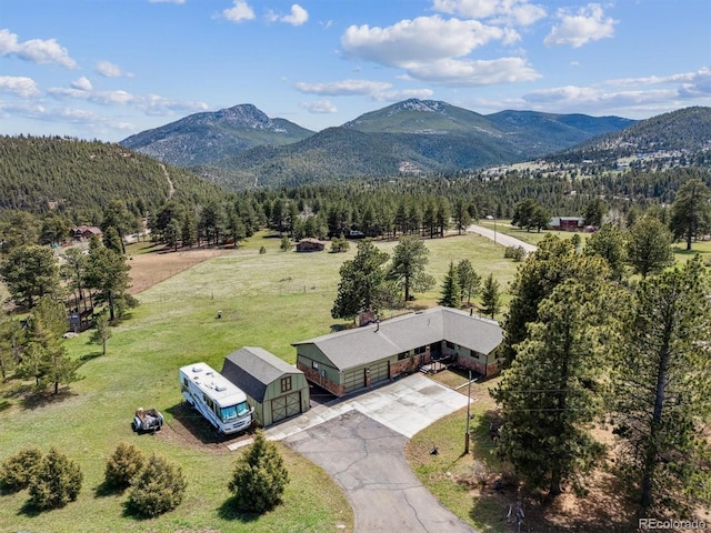 aerial view with a view of trees and a mountain view
