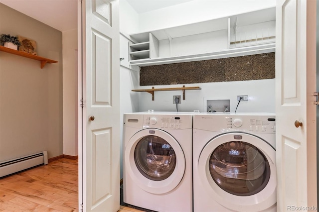 laundry room featuring laundry area, light wood finished floors, separate washer and dryer, baseboards, and a baseboard radiator