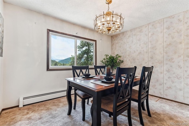 carpeted dining area with baseboards, a textured ceiling, a notable chandelier, and baseboard heating