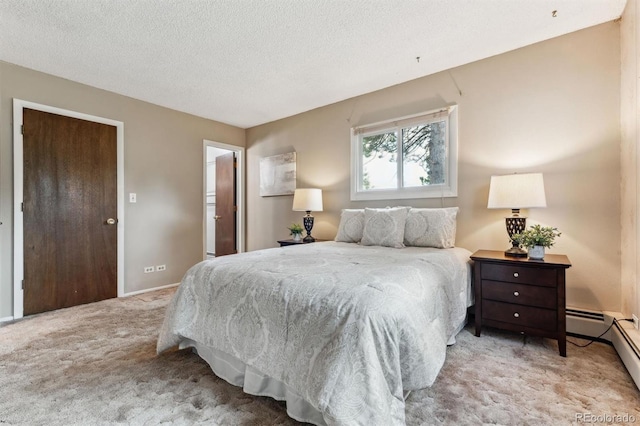 bedroom featuring carpet floors, a textured ceiling, and baseboards