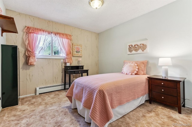 bedroom featuring carpet, a baseboard heating unit, and a textured ceiling