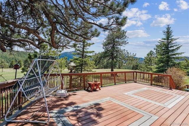 wooden terrace with a mountain view