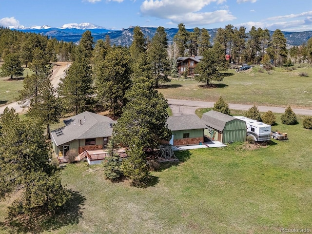 birds eye view of property featuring a mountain view
