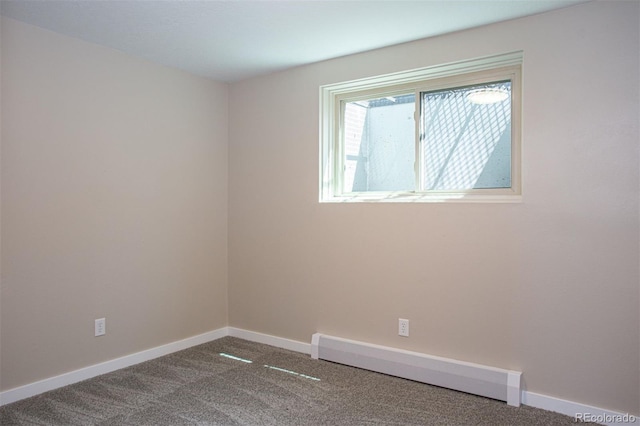 1153 Straight Creek Dr Unit F102, Dillon, CO 80435 - empty room with a baseboard radiator, carpet, and baseboards