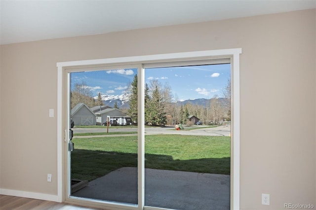1153 Straight Creek Dr Unit F102, Dillon, CO 80435 - entryway with a mountain view, wood finished floors, and baseboards