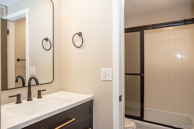 1153 Straight Creek Dr Unit F102, Dillon, CO 80435 - bathroom with vanity, toilet, and bath / shower combo with glass door