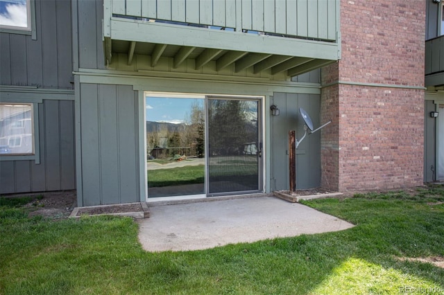 1153 Straight Creek Dr Unit F102, Dillon, CO 80435 - entrance to property featuring board and batten siding, a lawn, and brick siding