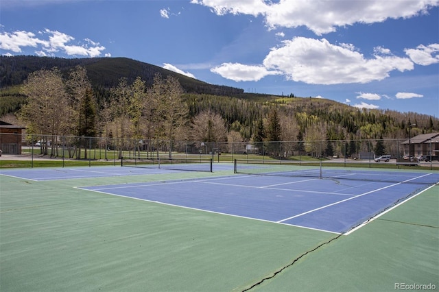1153 Straight Creek Dr Unit F102, Dillon, CO 80435 - view of tennis court featuring a wooded view, a mountain view, and community basketball court