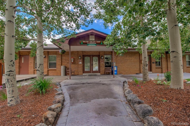 1153 Straight Creek Dr Unit F102, Dillon, CO 80435 - view of front of house with french doors and brick siding