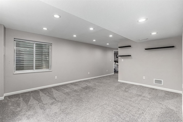 carpeted empty room with recessed lighting and baseboards