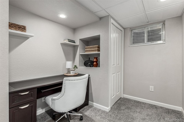 carpeted office space featuring baseboards, recessed lighting, and built in study area