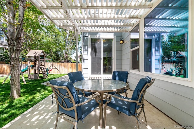 view of patio with outdoor dining area, a pergola, and a playground