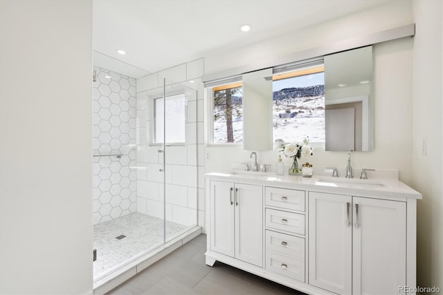 bathroom featuring tile patterned floors, vanity, and an enclosed shower