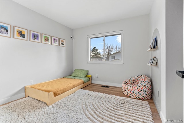 bedroom featuring hardwood / wood-style floors