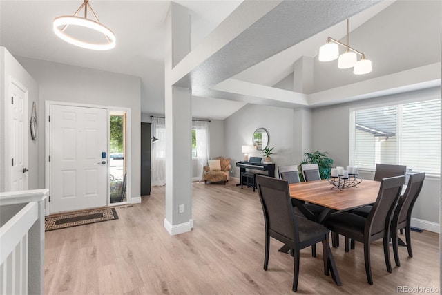 5332 S Lisbon Way, Centennial, CO 80015 - dining area with baseboards, light wood-type flooring, and vaulted ceiling