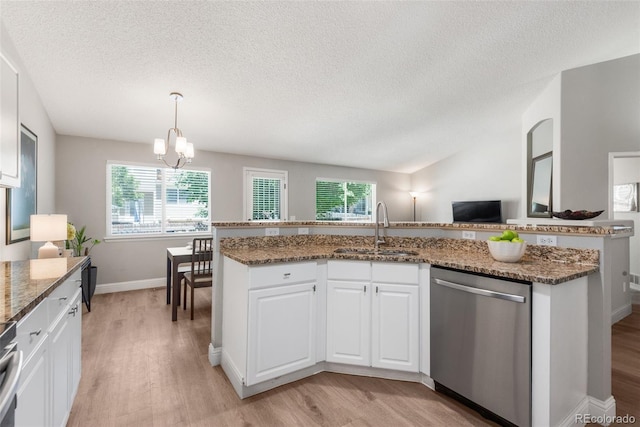 5332 S Lisbon Way, Centennial, CO 80015 - kitchen with stainless steel dishwasher, a sink, light wood-style flooring, a textured ceiling, and a chandelier