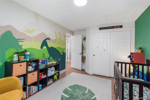 5332 S Lisbon Way, Centennial, CO 80015 - bedroom with wood finished floors, attic access, a closet, and baseboards