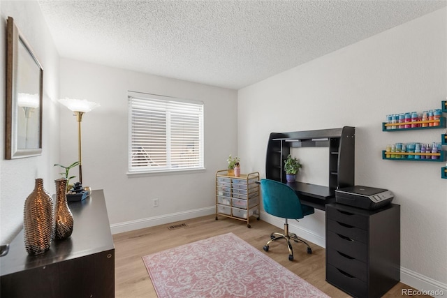5332 S Lisbon Way, Centennial, CO 80015 - office space featuring wood finished floors, a textured ceiling, and baseboards