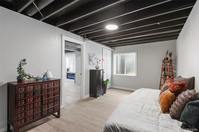 5332 S Lisbon Way, Centennial, CO 80015 - bedroom with light wood-style floors, multiple windows, and baseboards