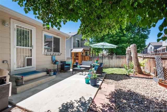 5332 S Lisbon Way, Centennial, CO 80015 - fenced backyard featuring an outdoor hangout area and a patio area