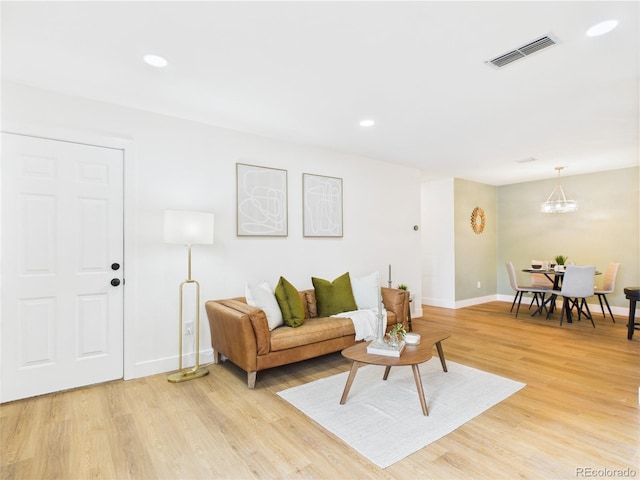 7205 S Gaylord St Unit G, Centennial, CO 80122 - living room featuring light wood-style flooring, baseboards, a chandelier, and recessed lighting