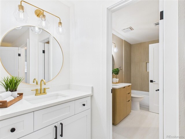 7205 S Gaylord St Unit G, Centennial, CO 80122 - bathroom with vanity, tile patterned flooring, toilet, and a bathtub