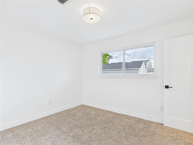 7205 S Gaylord St Unit G, Centennial, CO 80122 - carpeted spare room featuring baseboards