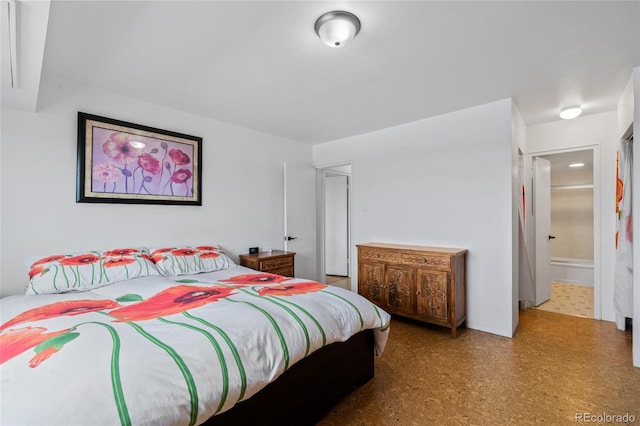 bedroom featuring ensuite bath