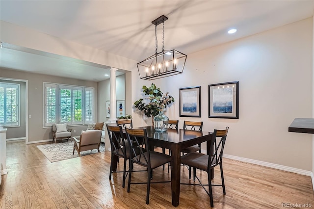 222 S Monroe St, Denver, CO 80209 - dining room featuring ornate columns, light wood-style floors, baseboards, and recessed lighting