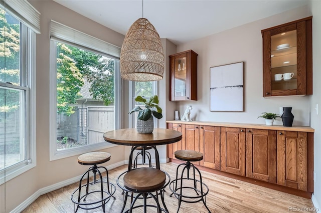 222 S Monroe St, Denver, CO 80209 - dining room featuring light wood-style flooring and baseboards