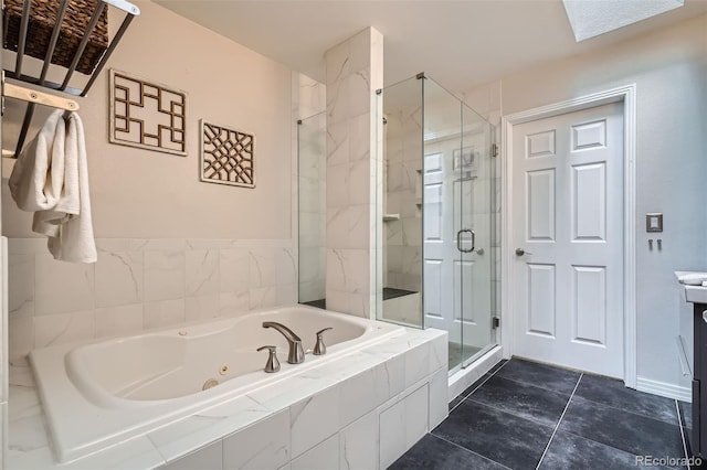 222 S Monroe St, Denver, CO 80209 - bathroom with a shower stall, a tub with jets, vanity, and tile patterned flooring